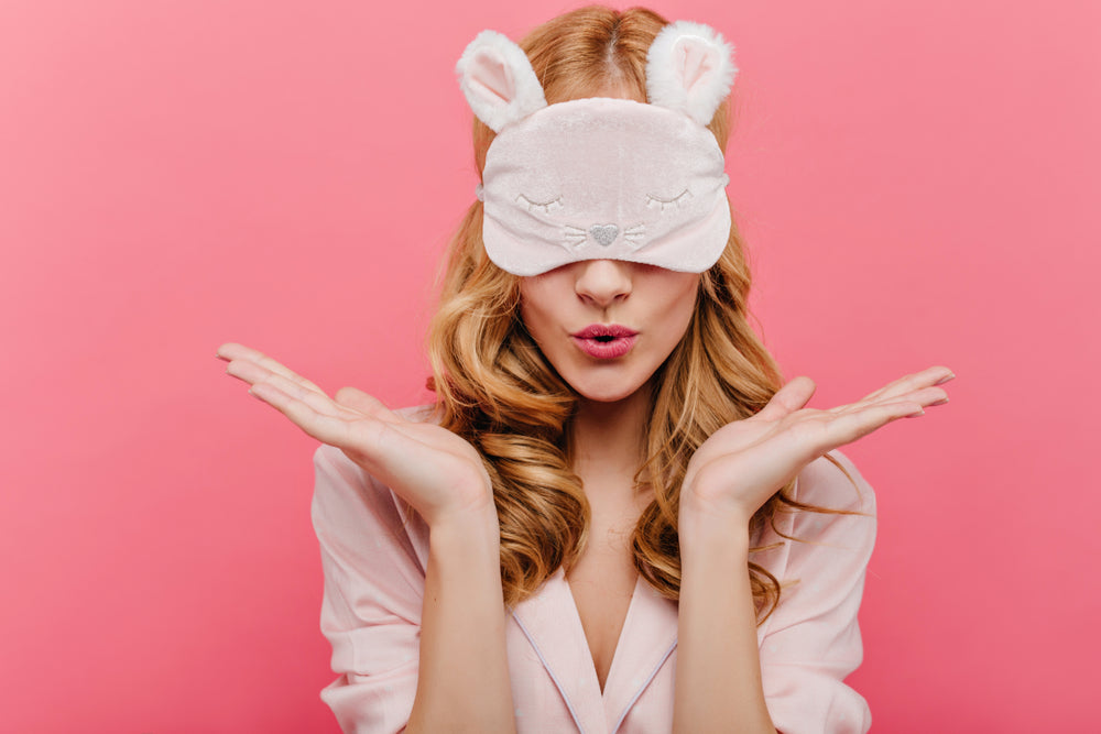 girl putting on blindfold