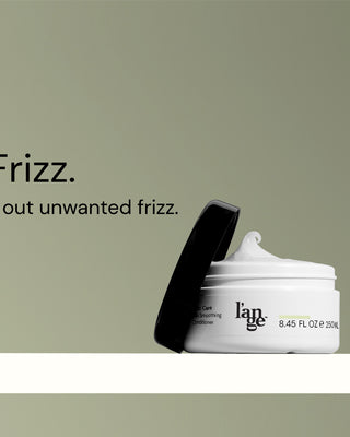 Hair care products from l'ange, including a smoothing shampoo, conditioner, and flyaway smoothing spritz, set against a green background with the text "It's Over, Frizz. Lock-in style. Lock out unwanted frizz."