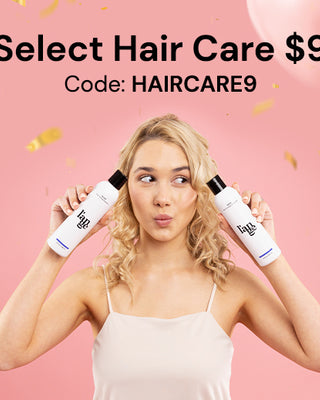 Woman holding two hair care bottles against a pink background with balloons and confetti, promoting a $9 hair care sale with the code HAIRCARE9.