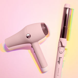 Close-up of L’ange hair dryer and curling iron on pastel background