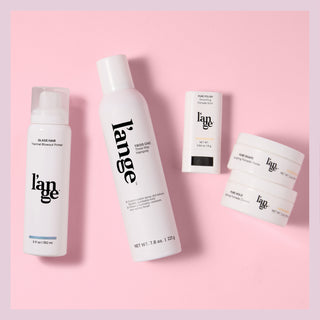 Four L'ange hair care products on a pink background (Glass Hair, Trois Chic, Pure Polish, Pure Hold, and Pure Shape)