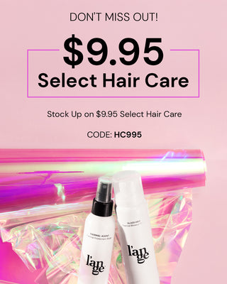 Promotional offer for select hair care products at $9.95, featuring thermal protectant spray and blowout primer with a holographic background.