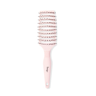 The pink flexible brush stands vertically so you can clearly see the vents & black bristles.