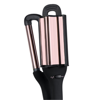 A curling iron with a sleek black handle and rose gold barrels designed for creating waves.
