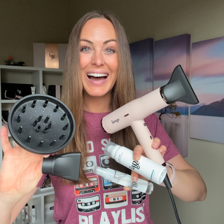 Smiling individual showcasing a hairdryer, diffuser, nozzle attachment, and two hair care products against a decorative background.
