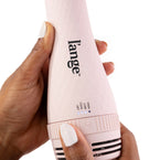 Blush tear-drop brush dryer with temperature twist handle held by dark skin hand