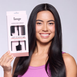 Woman holding L’ange Carbon Fiber Comb Set packaging.