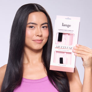 Woman holding L’ange Carbon Fiber Comb Set packaging.