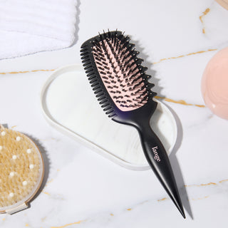 Curl Sculptor brush on a vanity tray