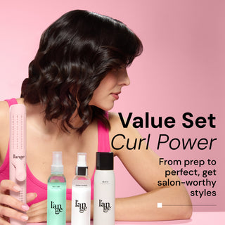 Woman with glossy hair showcasing the results of the Curl Power Value Set. Value Set includes: blush Le Duo Classic styler, a bottle of "Salt + Séa" texturizing spray, a bottle of "Thermal Magique" heat and humidity tamer, and a can of "Déjà Vu" dry shampoo. Text reads, "Value Set Curl Power" followed by the tagline, "From prep to perfect, get salon-worthy styles."