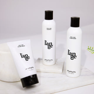 Two white 8fl oz bottle of Curl Care Shampoo & Conditioner with 4fl oz bottle Curl Care Styling Cream