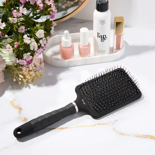 L’ange detangling paddle nylon brush on a vanity 