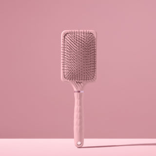 blush L’ange detangling paddle brush with nylon bristles standing upright on pink background