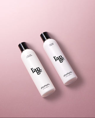 Value Set. L’ange curl hair care laid flat on a pink background including Curl Care Shampoo & Conditioner
