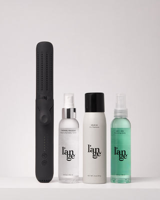 Value Set. L’ange hair products standing up on a grey background including Le Duo (Black - standard) , thermal magique, deja vu, salt +sea