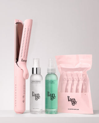 Value Set. L’ange hair products standing up on a grey background including Le Duo  Edge (blush) , thermal magique, salt + sea, and alligator hair clips