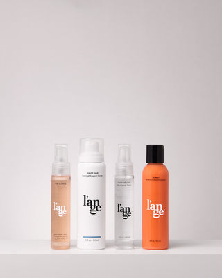 Value Set. L’ange hair care standing up on a grey background including oil serum, glass hair, satin nectar, and sorbet