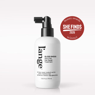 A white bottle of large Gloss Shock Anti-Friz Hair Repair Treatment with a black pump dispenser, shown on a light gray background with a red 'She Finds 2026 Beauty Awards Winner' badge on the upper right.