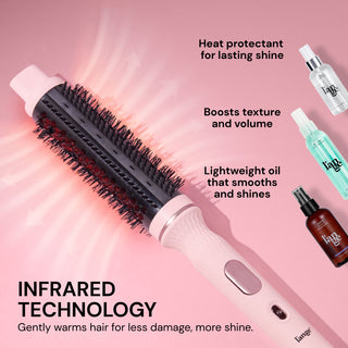 Features graphic. Text reads: "INFRARED TECHNOLOGY. Gently warms hair for less damage, more shine." Three callouts on the right read: "Heat protectant for lasting shine," "Boosts texture and volume," and "Lightweight oil that smooths and shines," each paired with an image of a L’ange product bottle. A pink-and-black heated round brush is shown across the image 