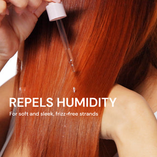 Person applying a product to red hair with text 'Repels Humidity' and 'For soft and sleek, frizz-free strands'.
