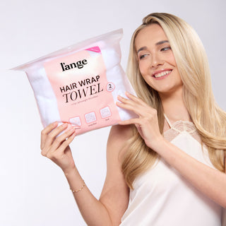 model holding a L'ange hair wrap towel bag