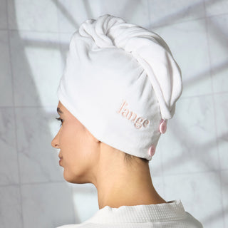 Woman with white hair wrap towel around her head