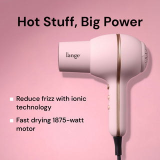  L'ange Hot Stuff blush hair dryer on pink background. "Hot Stuff, Big Power – Reduce frizz with ionic technology. Fast drying 1875-watt motor"