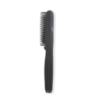 Side angle of black straightening brush features black cool-tipped ceramic bristles
