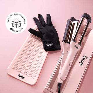 A hair styling set includes a dual-barrel curling iron, a wavy heat-resistant mat, and a black heat-resistant glove, all branded with "L'ange" and set against a pink background.