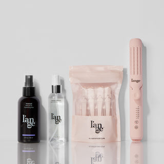 Four L'ange products displayed against a white background and mirrored surface.