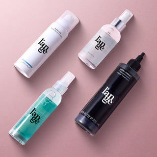 Le Quartet Best Sellers Hair Care Bundle  on a mauve pink background. Hydrate, protect, and add lasting texture with this curated collection of customer favorites.