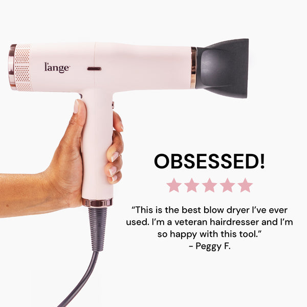 Le Styliste Luxury Salon Dryer has an air concentrator attached above a 5-star review left by a professional hairdresser.