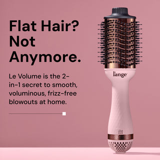 L’ange Le Volume hot air brush standing upright on a pink background, with bold black text that reads: ‘Flat Hair? Not Anymore.’ Subheading states: ‘Le Volume is the 2-in-1 secret to smooth, voluminous, frizz-free blowouts at home