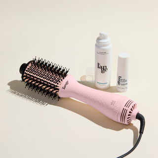 The Fresh Blowout Trio Value Set featuring a Blush 60mm Le Volume,  Glass Hair, and Sky Lift, displayed on a beige background.