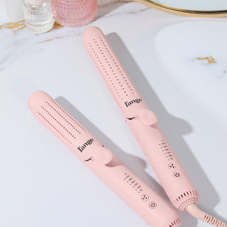 Two sleek, pink hair styling tools with adjustable temperature settings, featuring a minimalist design and ergonomic handle.