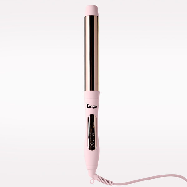 A pink L'ange curling iron with a metallic barrel, shown vertically against a clean white background.