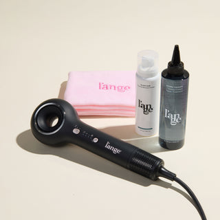 Mane Event Value Set, featuring a Black Axia, a Blush hair wrap towel, Hydro Therapy, and Glass Hair, displayed on a beige background