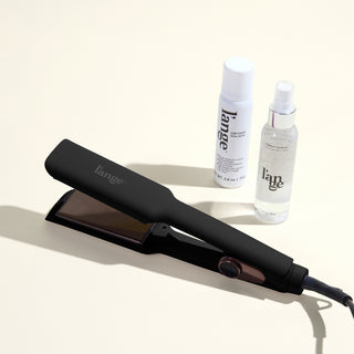 The Sleek Era Value Set, featuring a black 1.75in Le Titane , top coat, and thermal magique, displayed on a beige background