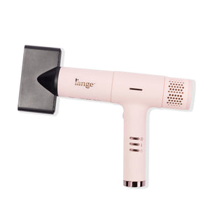 Slim blush t-shape hair dryer with heat, speed, power buttons and larger black air concentrator