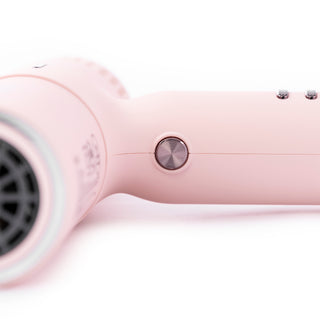 Zoomed in view of blush hair dryer with rose gold cool shot button