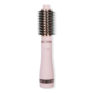 Multi Volume Series 43mm round brush blow dryer in blush pink with rose gold barrel and black bristles.