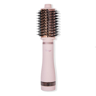 Multi Volume Series 60mm round brush blow dryer in blush pink with rose gold barrel and black bristles.