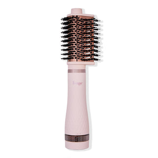 Multi Volume Series 65mm teardrop brush blow dryer in blush pink with rose gold barrel and black bristles.