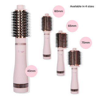 The 4 different interchangeable brush head attachments for Multi-Volume Series sit next to the assembled brush dryer.