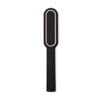 The back of a black, sleek straightening comb with a smooth finish. 