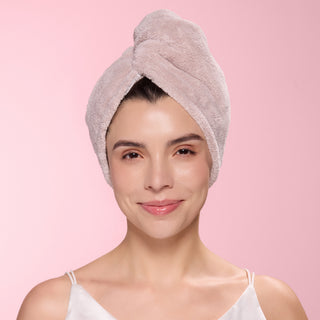 Woman with gray hair wrap towel around her head