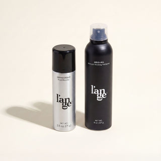 L'ange Rise & Set bundle. Two hair care products, Grand Debut Root Booster and Hold-All Medium Working Hairspray, are standing on a beige background