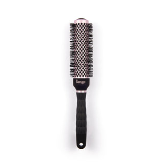 Black round brush for styling hair with a blow dryer. 