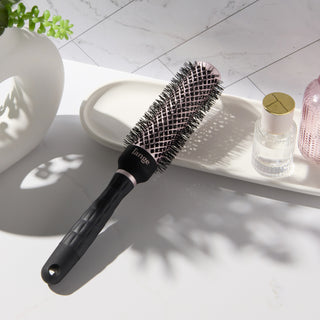 Round brush on vanity. 