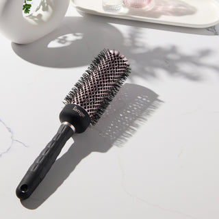 Round brush on vanity. 